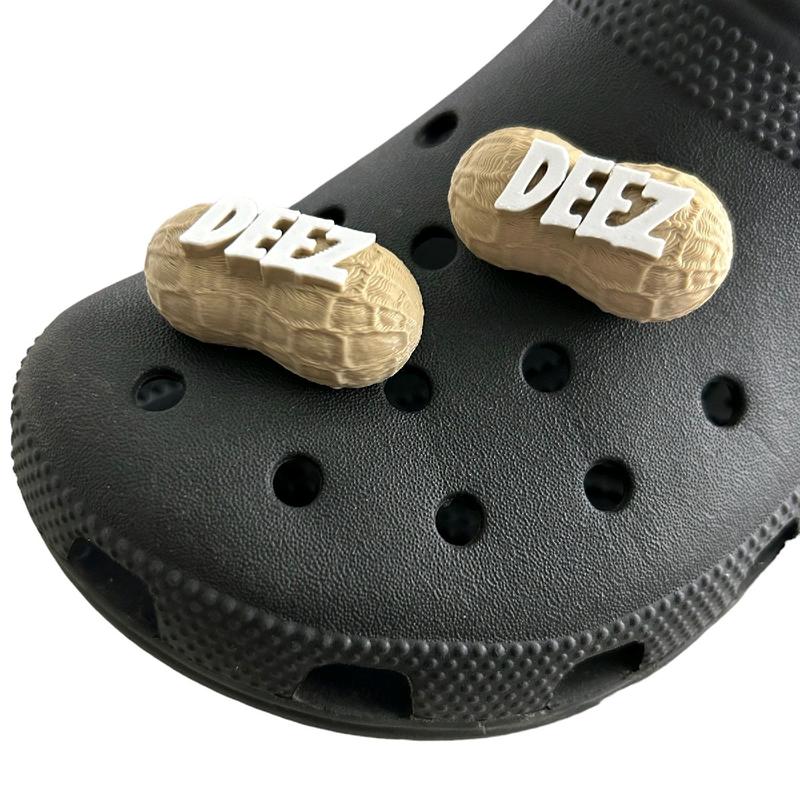 DEEZ NUTS funny clog charms 2 pack, Made in America,  universal fit for most size clog style shoes, unique patented design bold DEEZ lettering on a hard lightweight plastic peanut, simple push into clog style shoes. Footwear